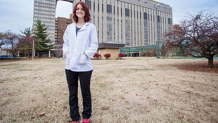 Student Bethanie Funderburk standing on the lawn in front of Barnes-Jewish hospital in Saint Louis