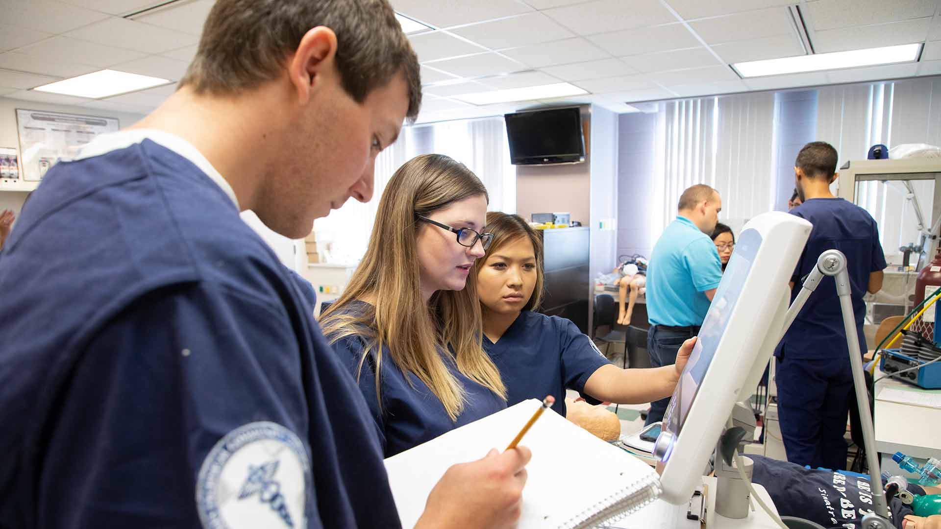 Respiratory therapy students in class lab.